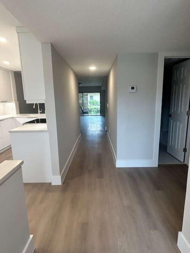 1101 Pinecrest Circle, Unit F Jupiter, FL 33458 - Photo 4 of 18 a view of entryway and kitchen