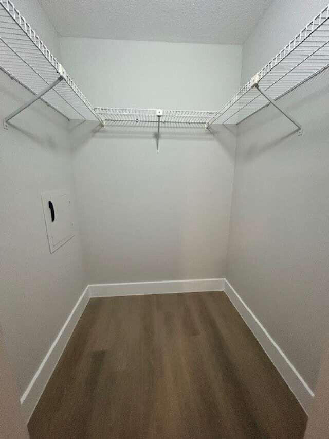 1101 Pinecrest Circle, Unit F Jupiter, FL 33458 - Photo 7 of 18 a view of a room with racks on the wall