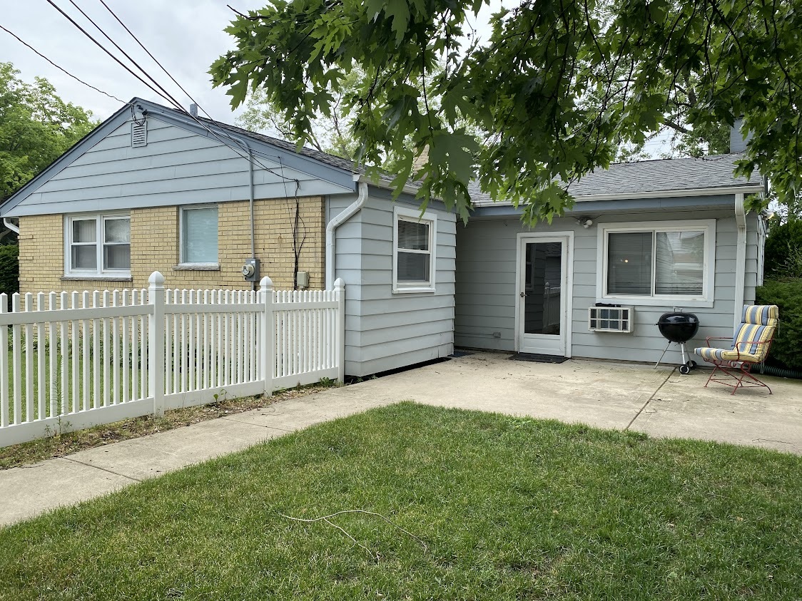 459 West Butterfield Road Elmhurst, IL 60126 - Photo 2 of 17 a view of a house with a yard and large tree