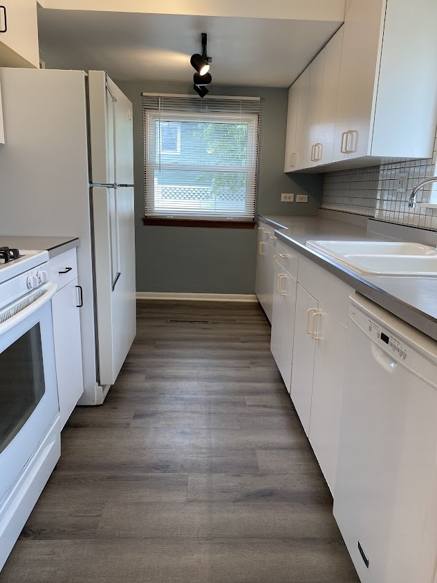459 West Butterfield Road Elmhurst, IL 60126 - Photo 5 of 17 a kitchen with granite countertop a sink and a stove top oven