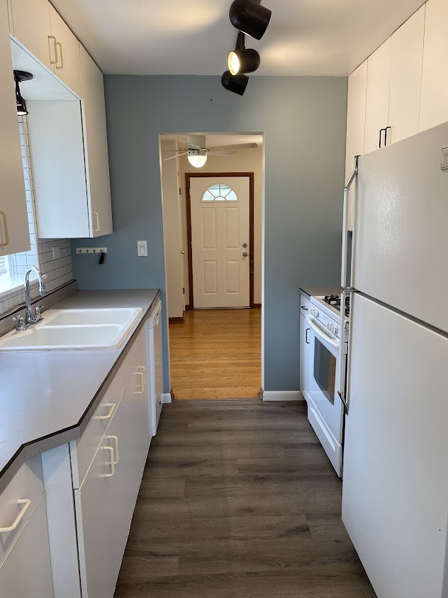 459 West Butterfield Road Elmhurst, IL 60126 - Photo 6 of 17 a kitchen with a sink and a refrigerator
