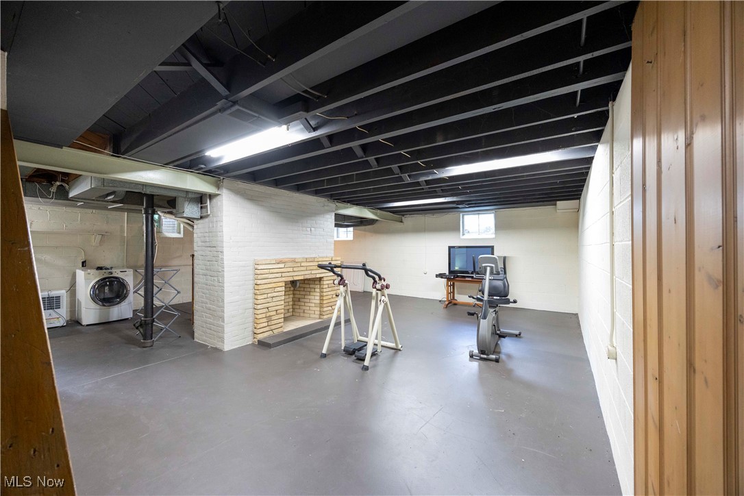 15724 Wyatt Road Cleveland, OH 44112 - Photo 35 of 47 Exercise room featuring washer / clothes dryer and finished concrete flooring