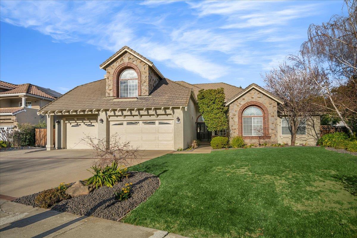 a front view of a house with garden