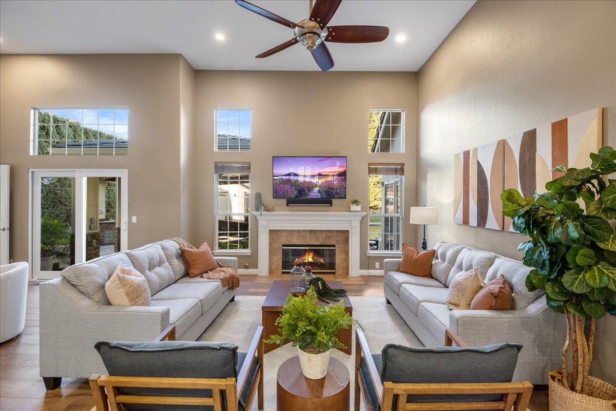 17446 Serene Drive Morgan Hill, CA 95037 - Photo 11 of 82 a living room with furniture fireplace and potted plants