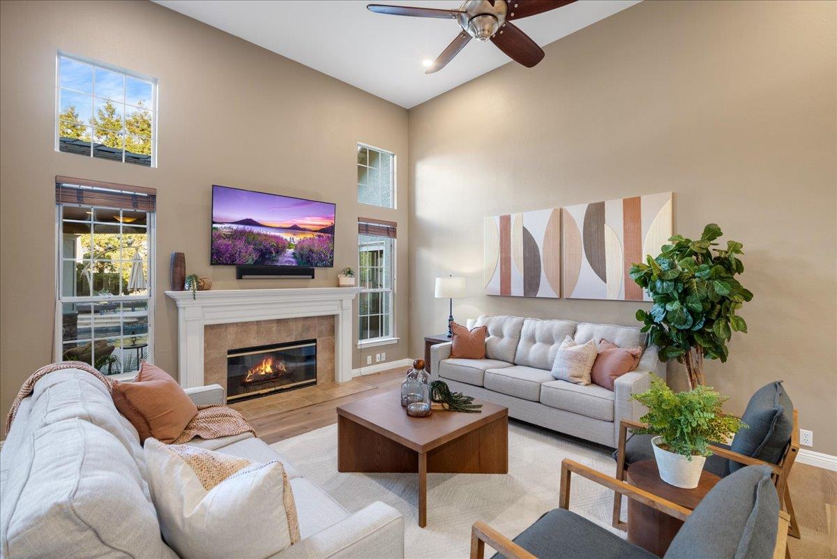 17446 Serene Drive Morgan Hill, CA 95037 - Photo 12 of 82 a living room with furniture a flat screen tv and a fireplace