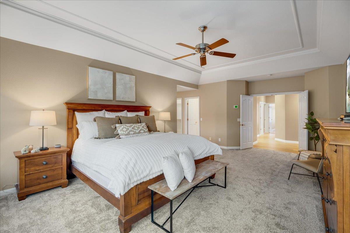 17446 Serene Drive Morgan Hill, CA 95037 - Photo 32 of 82 a spacious bedroom with a bed a table and chair