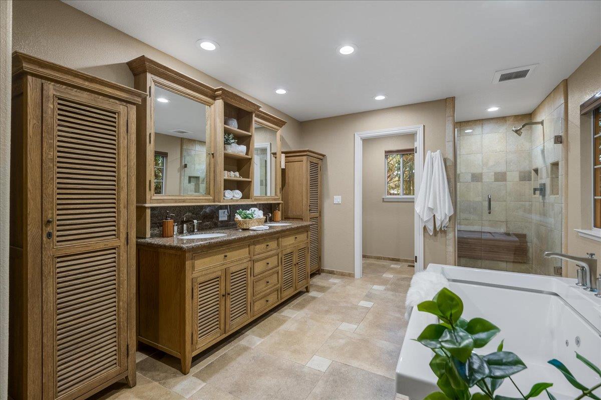 17446 Serene Drive Morgan Hill, CA 95037 - Photo 35 of 82 a bathroom with a double vanity sink and a bathtub
