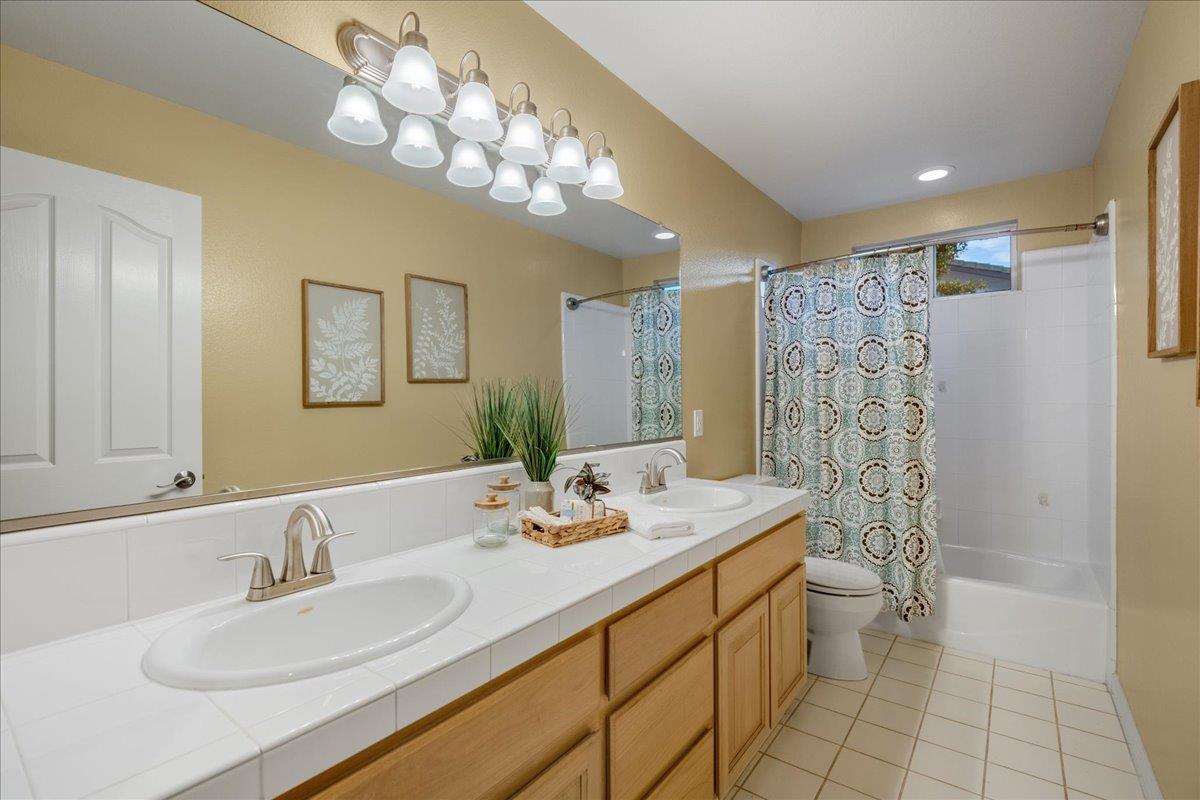 17446 Serene Drive Morgan Hill, CA 95037 - Photo 39 of 82 a bathroom with a double vanity sink mirror and shower