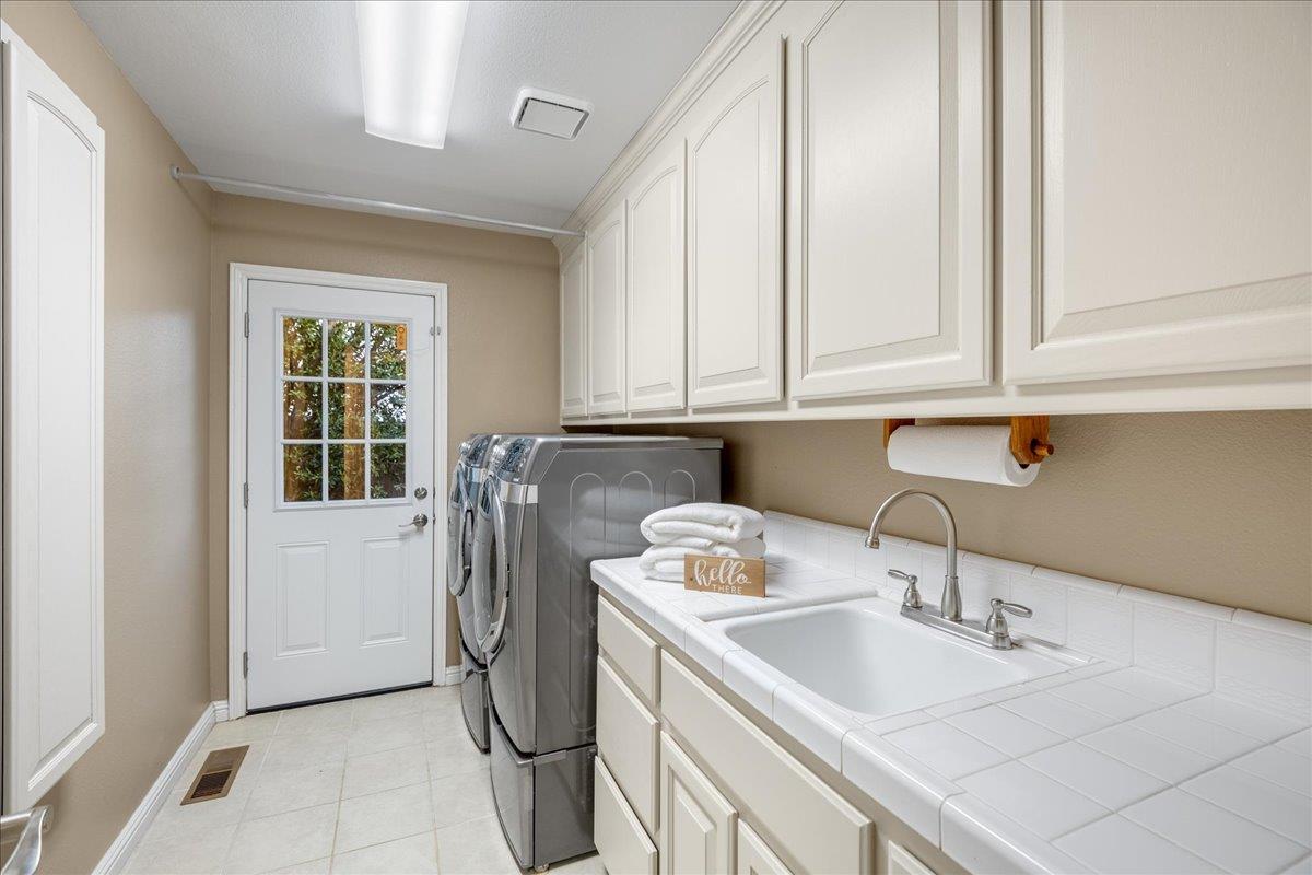 17446 Serene Drive Morgan Hill, CA 95037 - Photo 44 of 82 a utility room with sink dryer and washer
