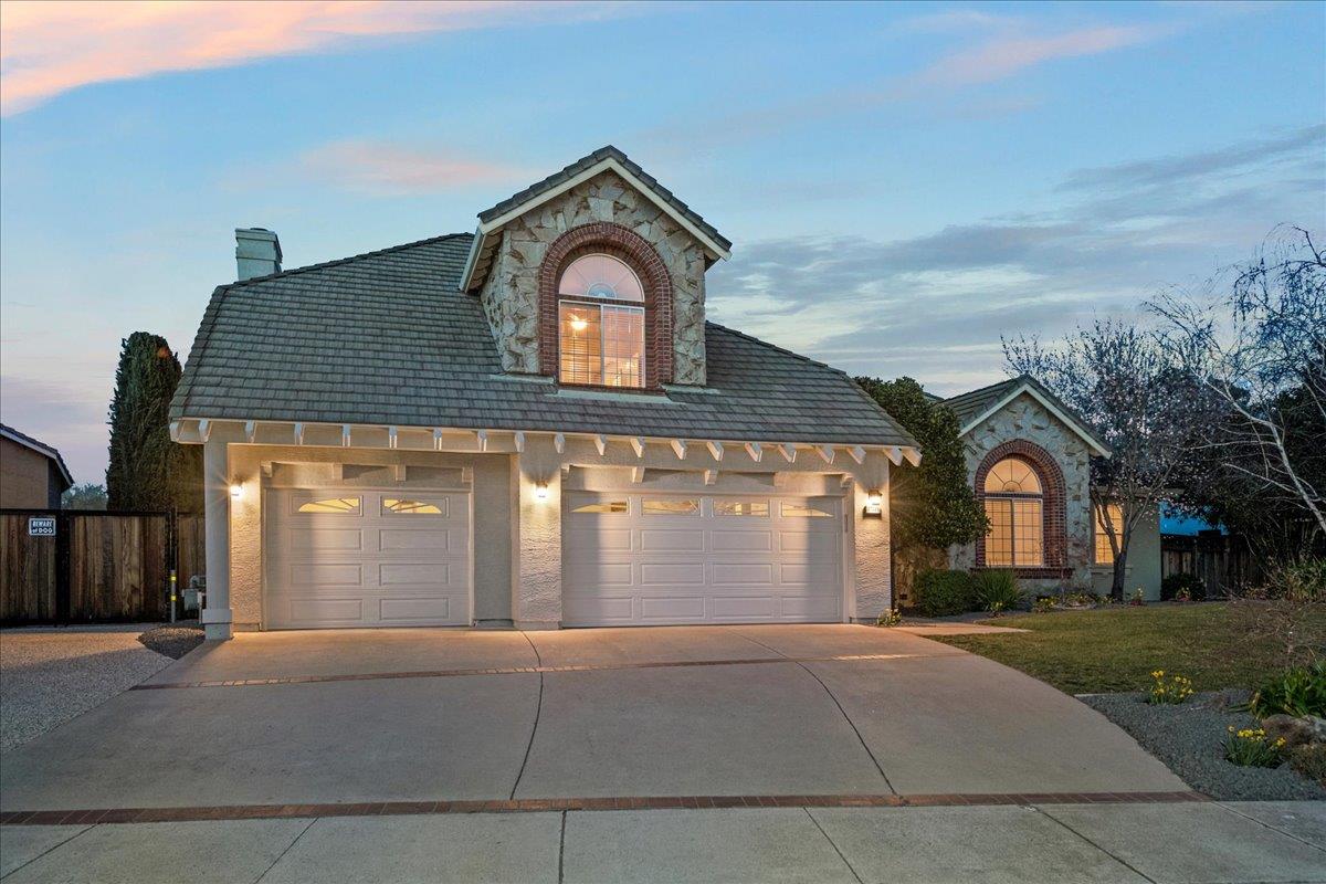 17446 Serene Drive Morgan Hill, CA 95037 - Photo 6 of 82 a front view of a house with a yard and garage