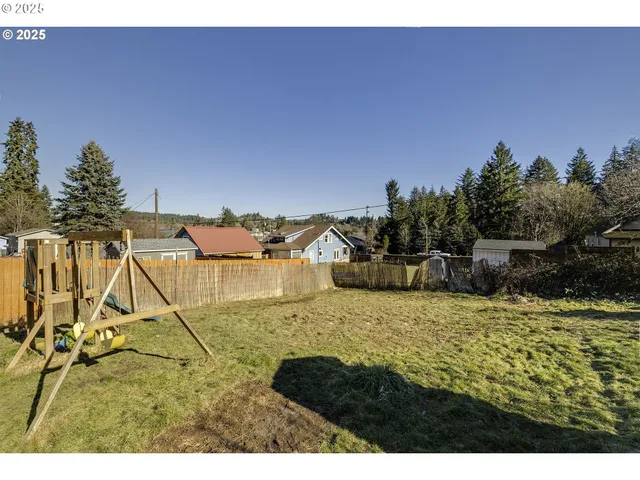 a aerial view of a house with a yard