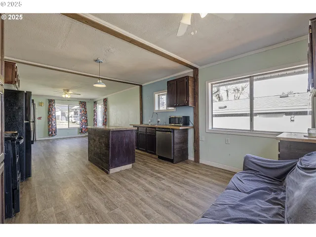 a living room with furniture window and wooden floor