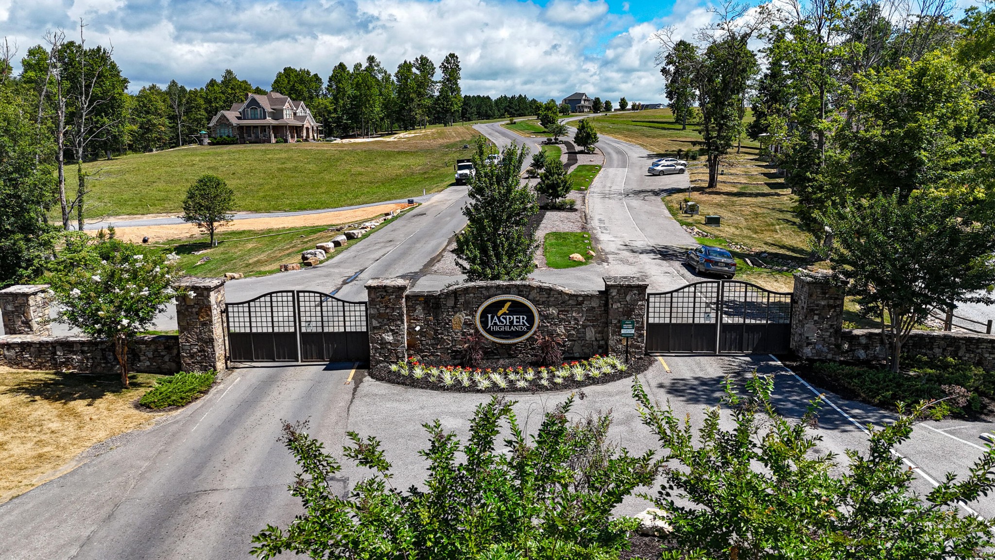 205 Poplar Bend Jasper, TN 37347 - Photo 1 of 17 a sign board with a small yard and trees all around