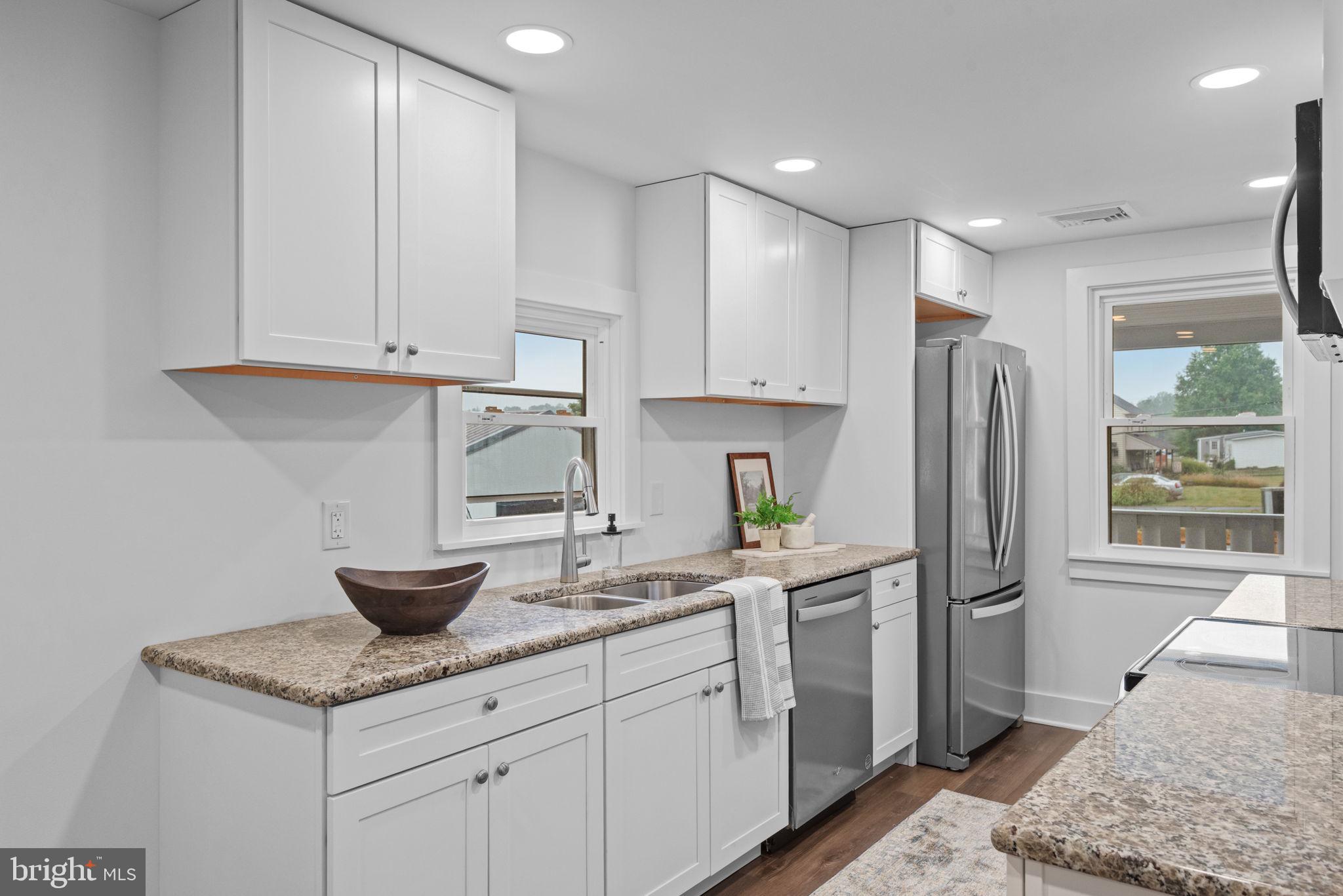 229 Cider Press Road Manheim, PA 17545 - Photo 12 of 47 a kitchen with stainless steel appliances granite countertop a refrigerator sink and cabinets