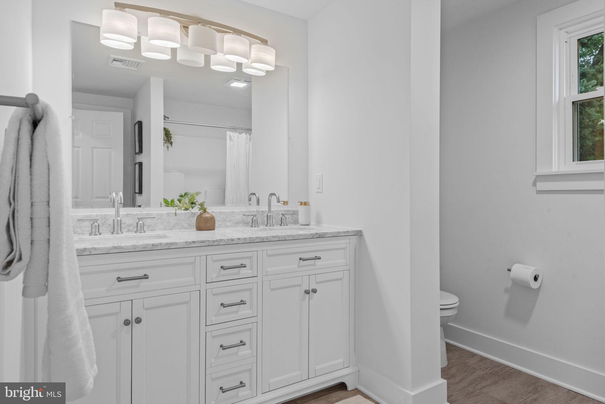 229 Cider Press Road Manheim, PA 17545 - Photo 20 of 47 a bathroom with a granite countertop sink a toilet and a mirror