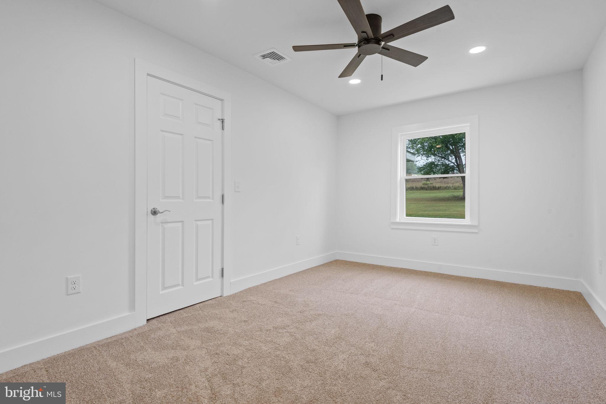 229 Cider Press Road Manheim, PA 17545 - Photo 23 of 47 an empty room with a window and a fan