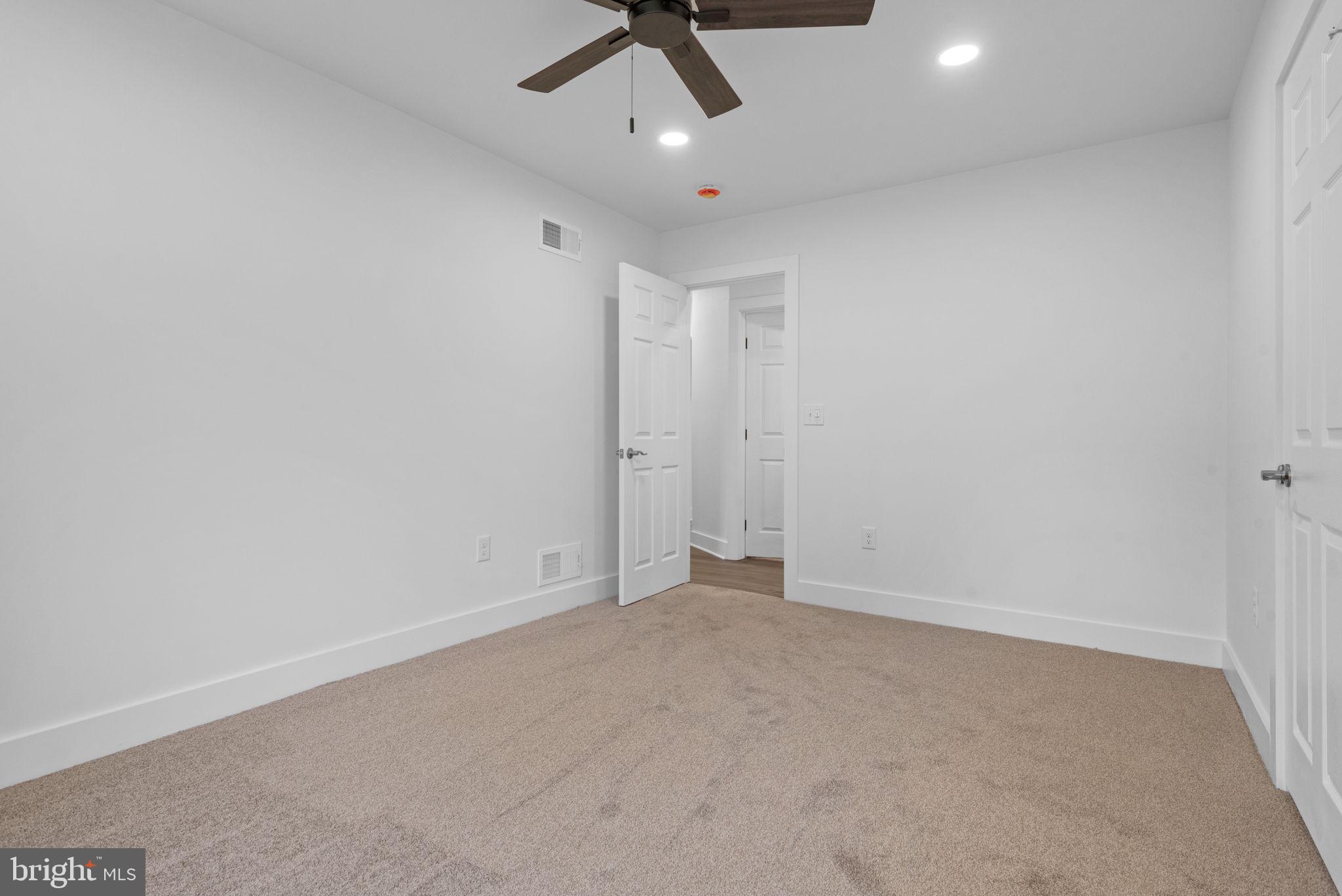 229 Cider Press Road Manheim, PA 17545 - Photo 24 of 47 an empty room with a ceiling fan and carpet