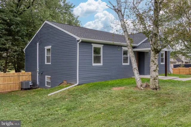 a backyard of a house with seating space