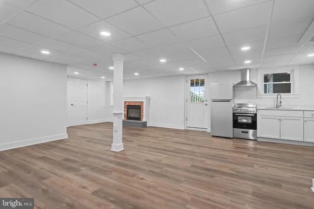 a view of kitchen with cabinets and wooden floor