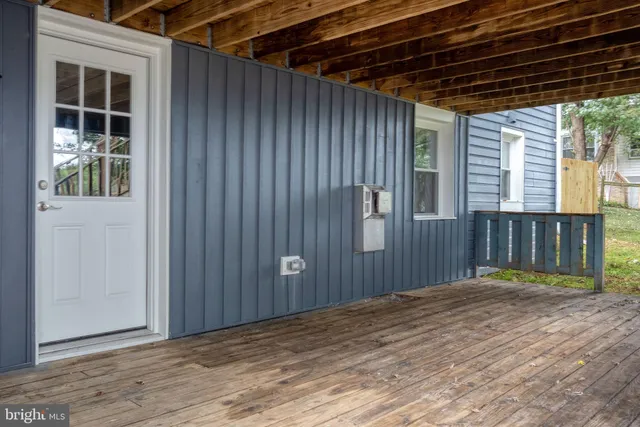a view of backyard with porch