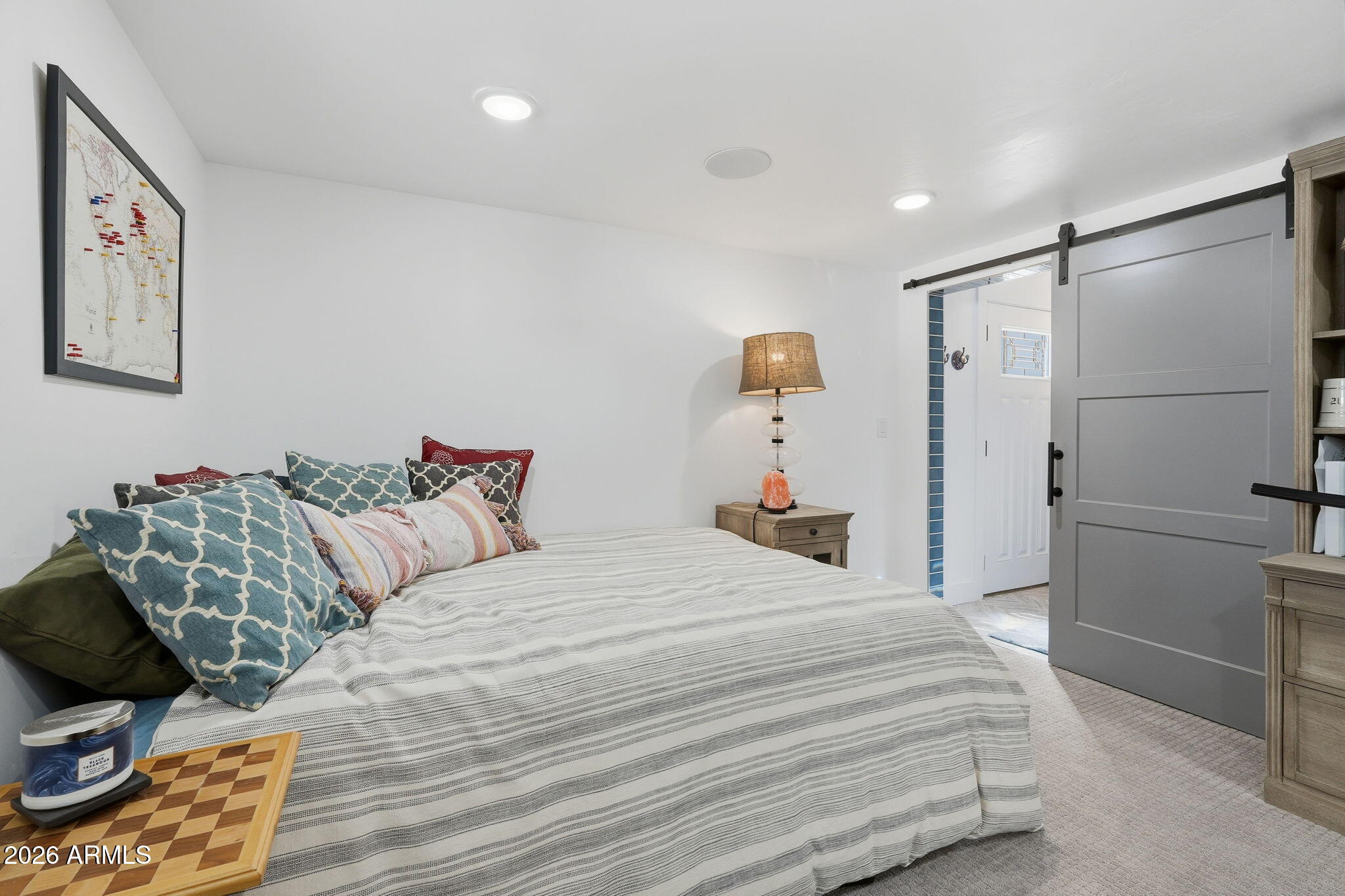 5149 North 34th Street Phoenix, AZ 85018 - Photo 42 of 70 a bedroom with a bed and a refrigerator