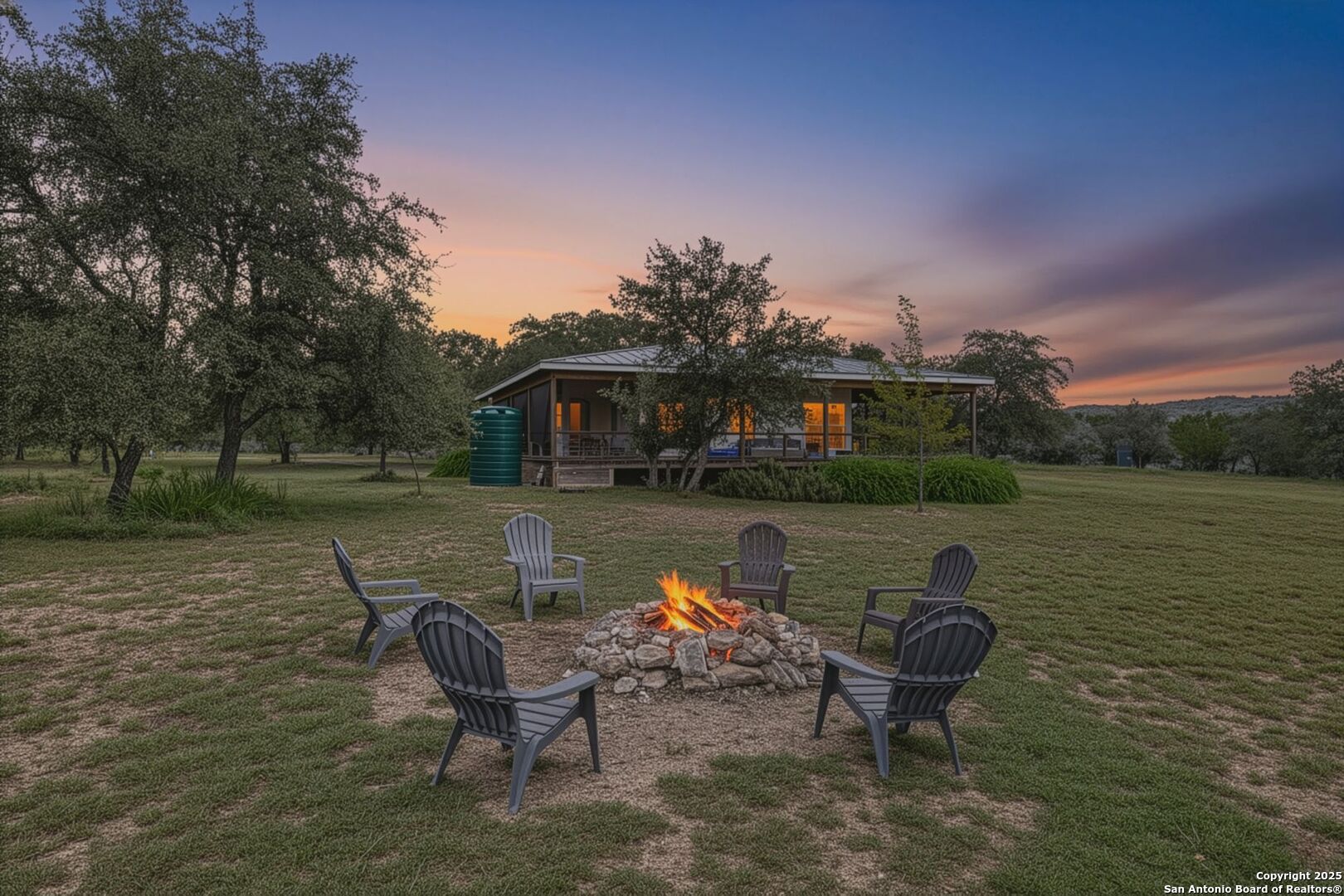 565 Loop Road Uvalde, TX 78801 - Photo 11 of 78 a swimming pool with outdoor seating and yard