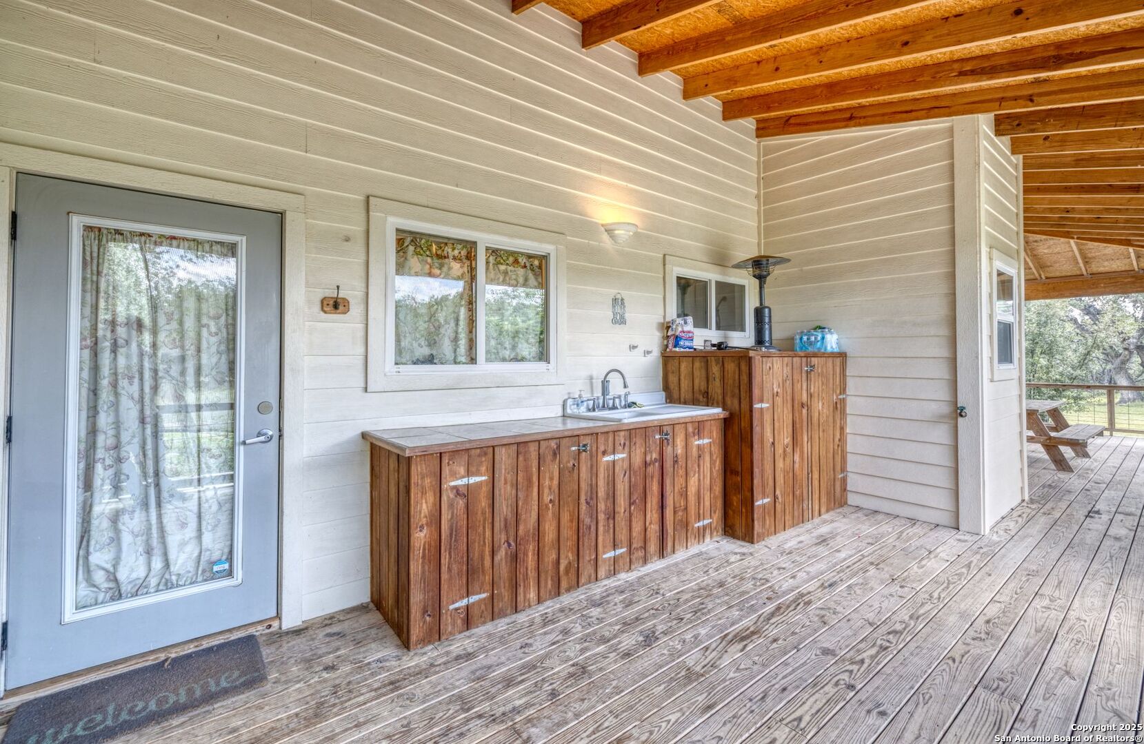 565 Loop Road Uvalde, TX 78801 - Photo 14 of 78 a view of a house with a wooden deck
