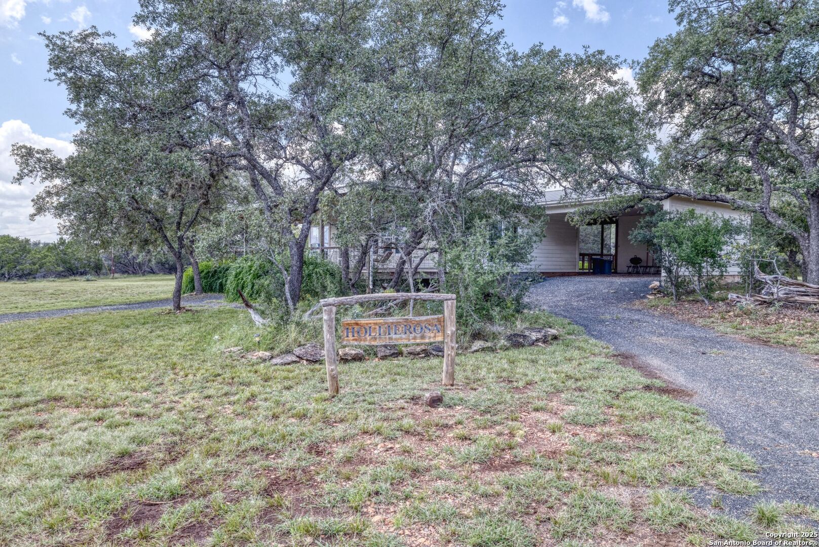 565 Loop Road Uvalde, TX 78801 - Photo 2 of 78 a view of a house with backyard and a tree