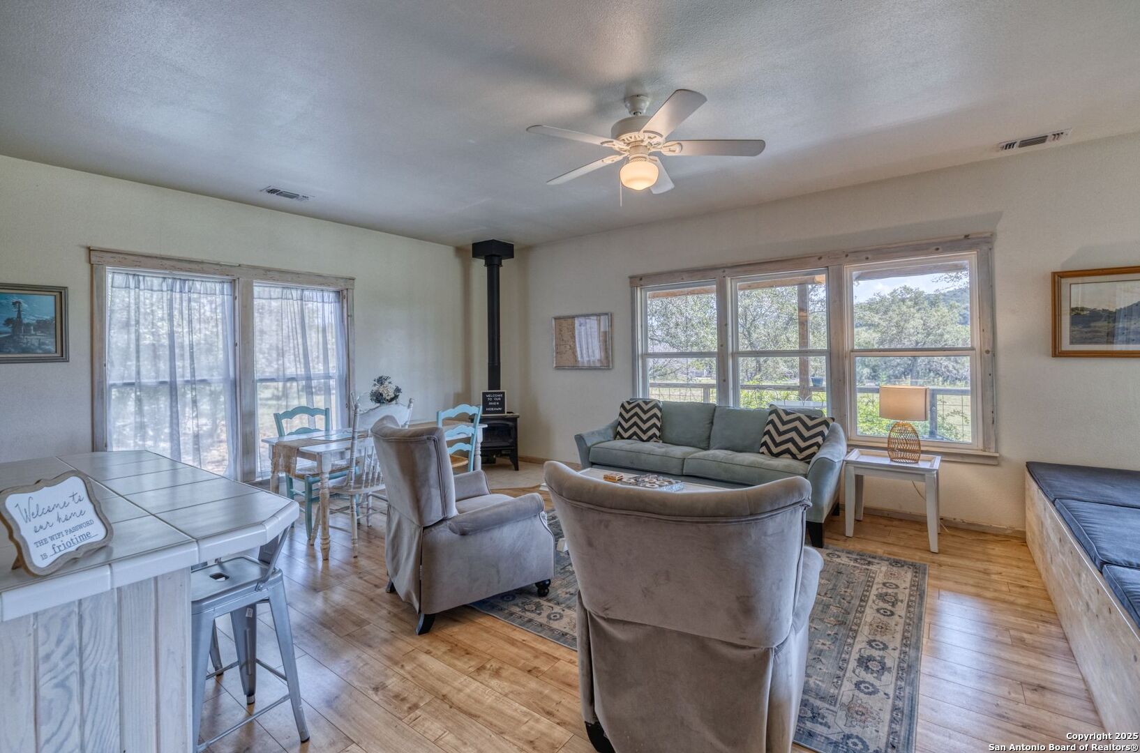 565 Loop Road Uvalde, TX 78801 - Photo 31 of 78 a living room with fireplace furniture and a floor to ceiling window