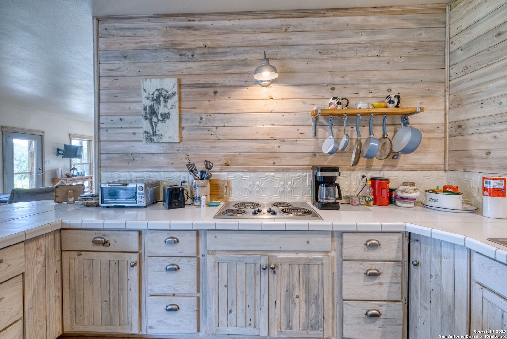 565 Loop Road Uvalde, TX 78801 - Photo 35 of 78 a kitchen with cabinets and window