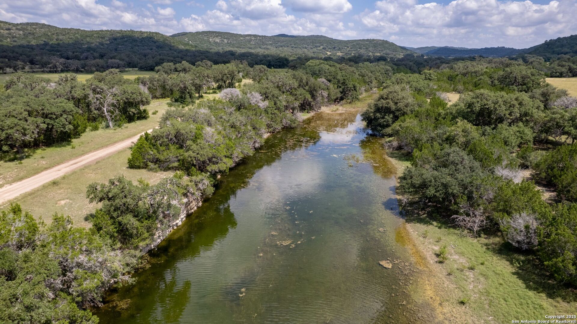 565 Loop Road Uvalde, TX 78801 - Photo 61 of 78 a view of a lake with a mountain