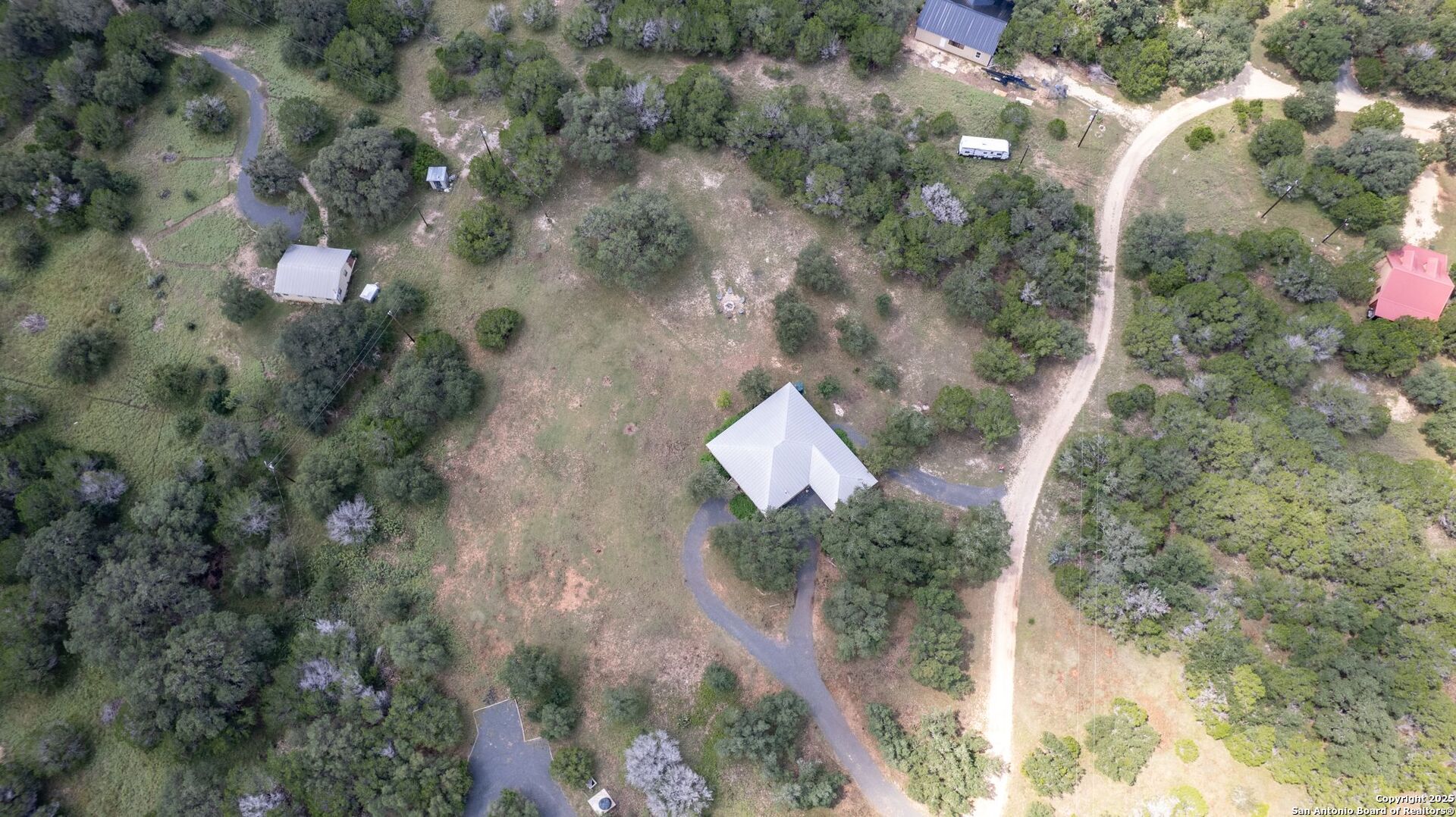 565 Loop Road Uvalde, TX 78801 - Photo 63 of 78 a aerial view of a house with a yard