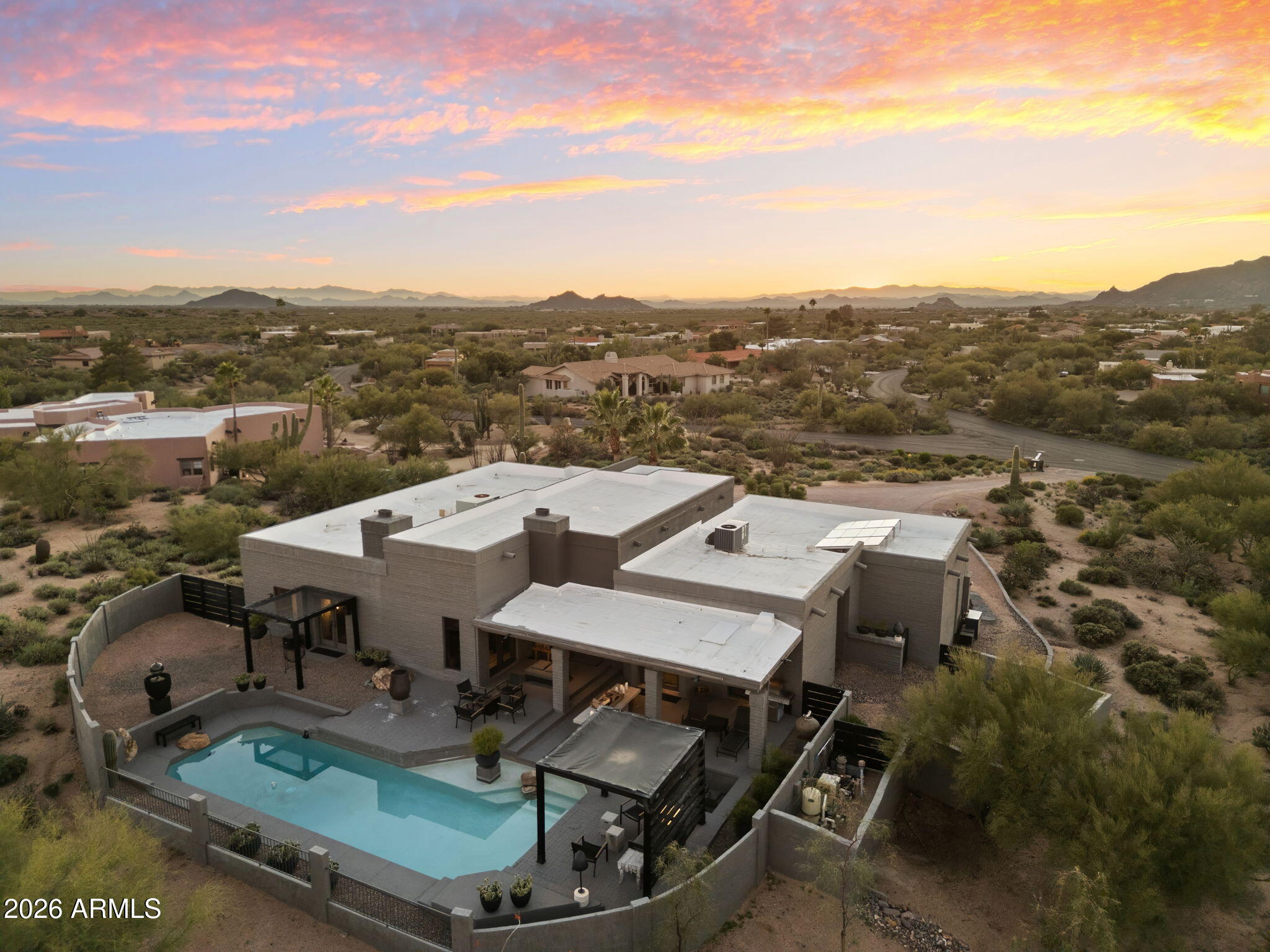 9545 East Romping Road, Unit 90 Carefree, AZ 85377 - Photo 22 of 32 an aerial view of a house with swimming pool and mountains