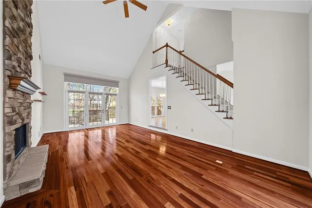 a view of an room with wooden floor and staircase