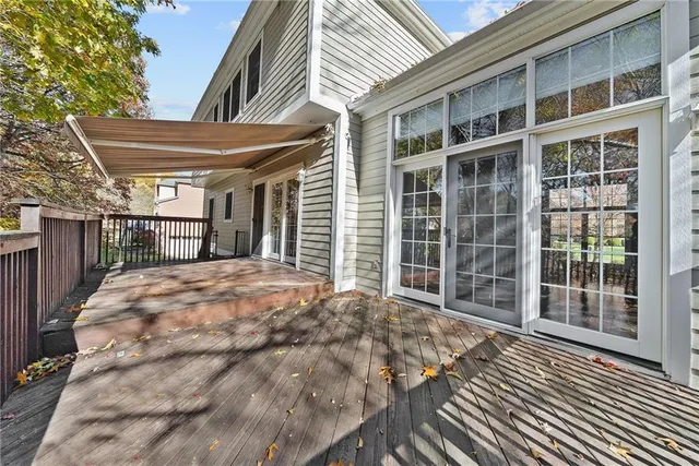 a view of balcony with wooden floor