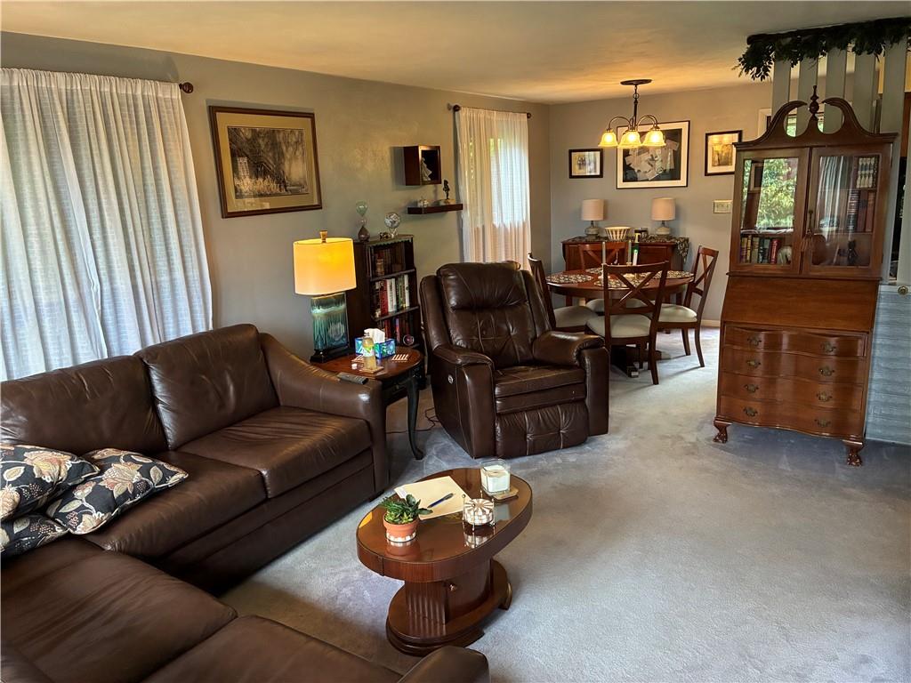 919 Braddock Road Pittsburgh, PA 15221 - Photo 3 of 11 a living room with furniture and a window
