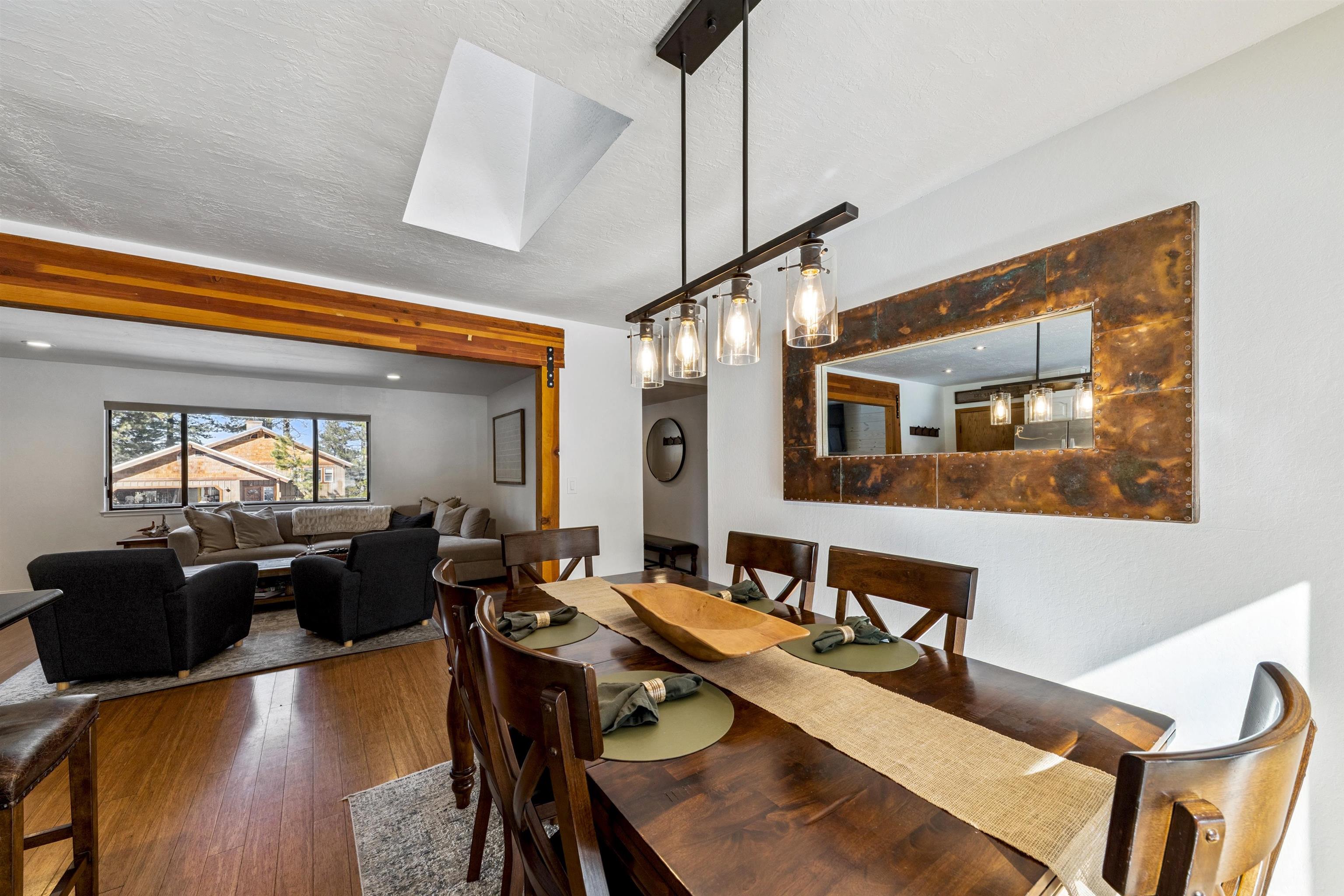 10895 Jeffery Pine Road Truckee, CA 96161 - Photo 14 of 25 a view of a dining room with furniture window and wooden floor