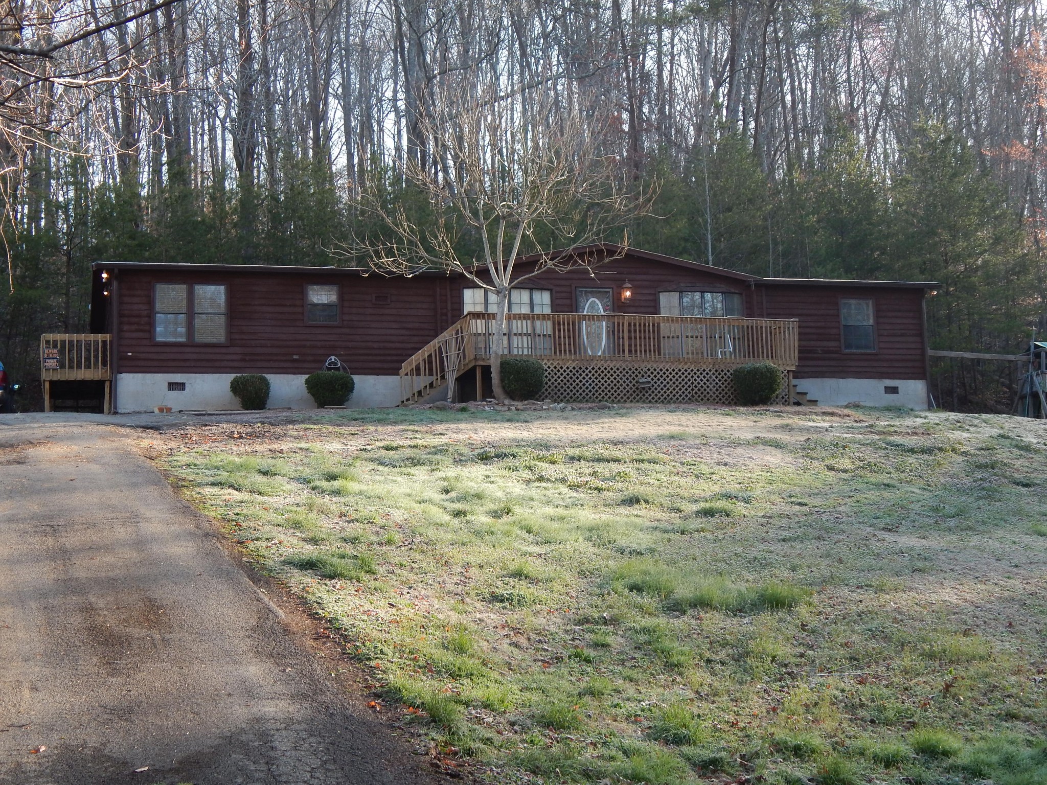 193 Crisman Road Heiskell, TN 37754 - Photo 1 of 31 a house with large trees in front of it
