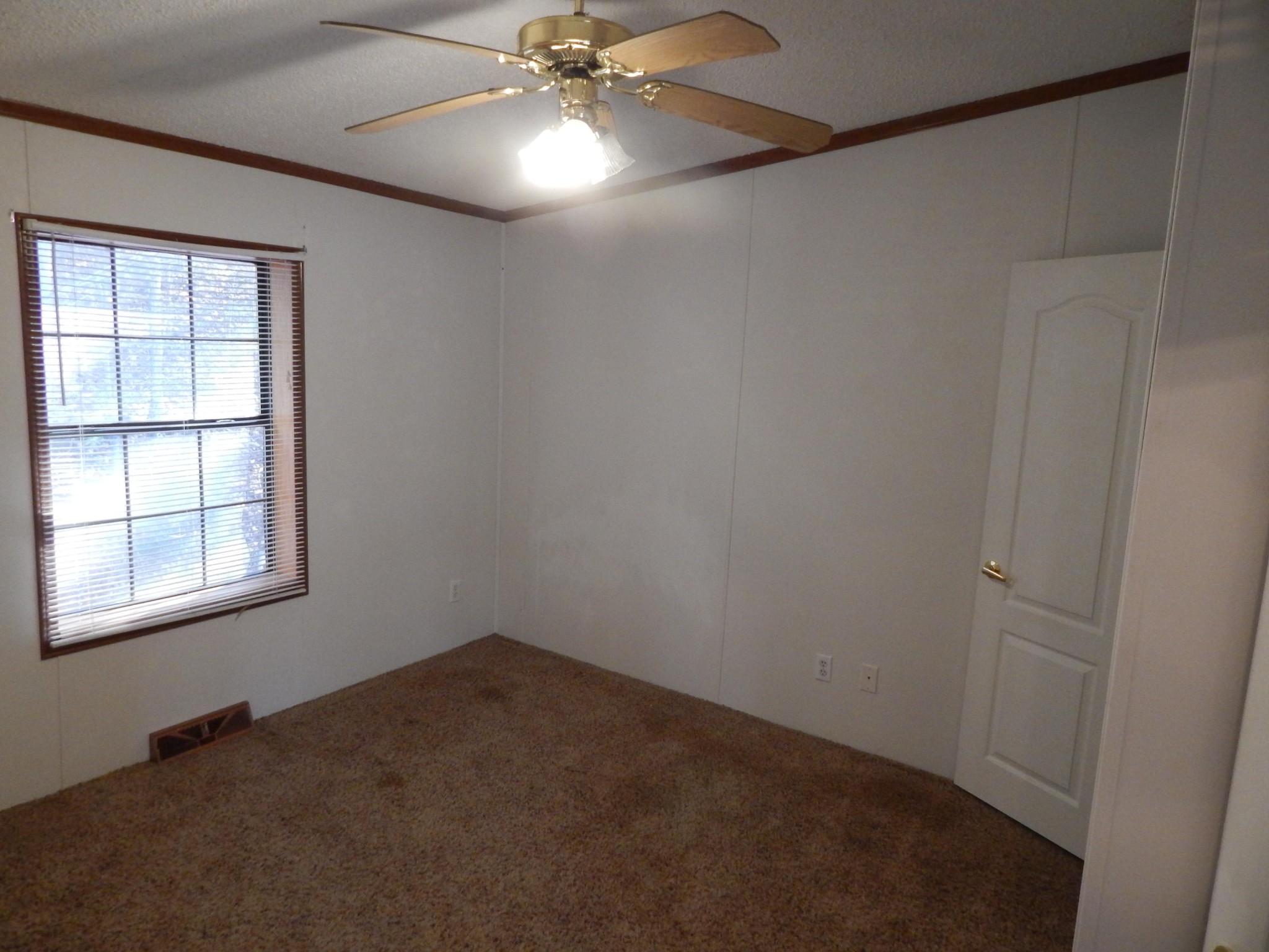 193 Crisman Road Heiskell, TN 37754 - Photo 15 of 31 an empty room with a window and a fan