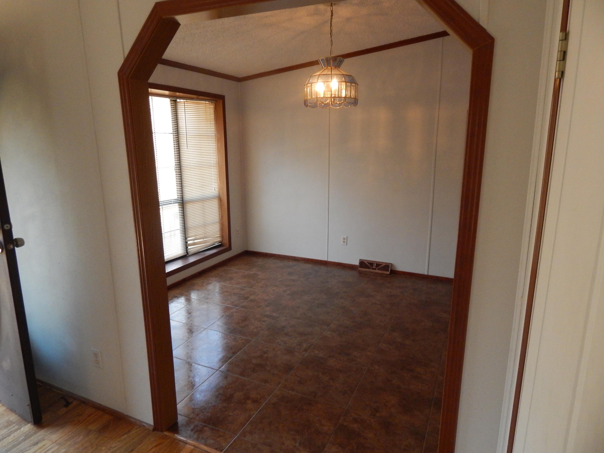 193 Crisman Road Heiskell, TN 37754 - Photo 19 of 31 an empty room with wooden floor fan and windows