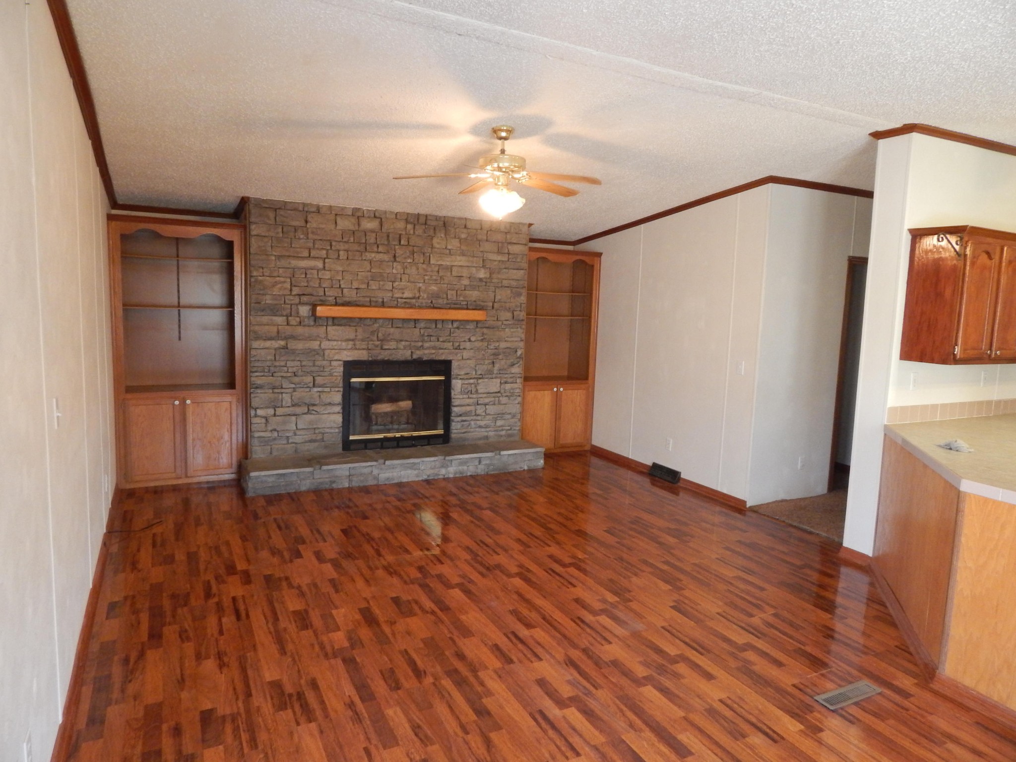 193 Crisman Road Heiskell, TN 37754 - Photo 22 of 31 a view of empty room with wooden floor and fireplace