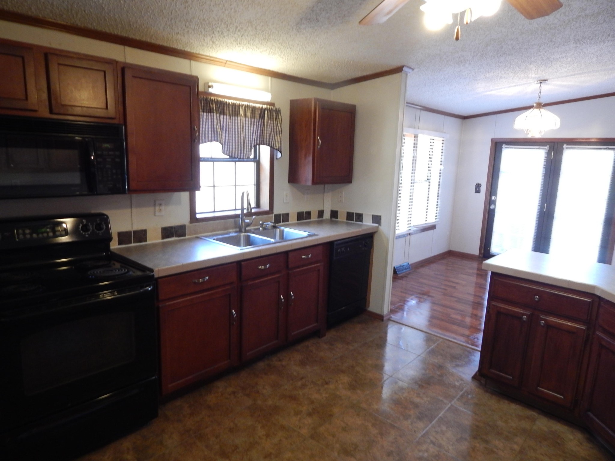 193 Crisman Road Heiskell, TN 37754 - Photo 27 of 31 a kitchen with a sink stove and cabinets
