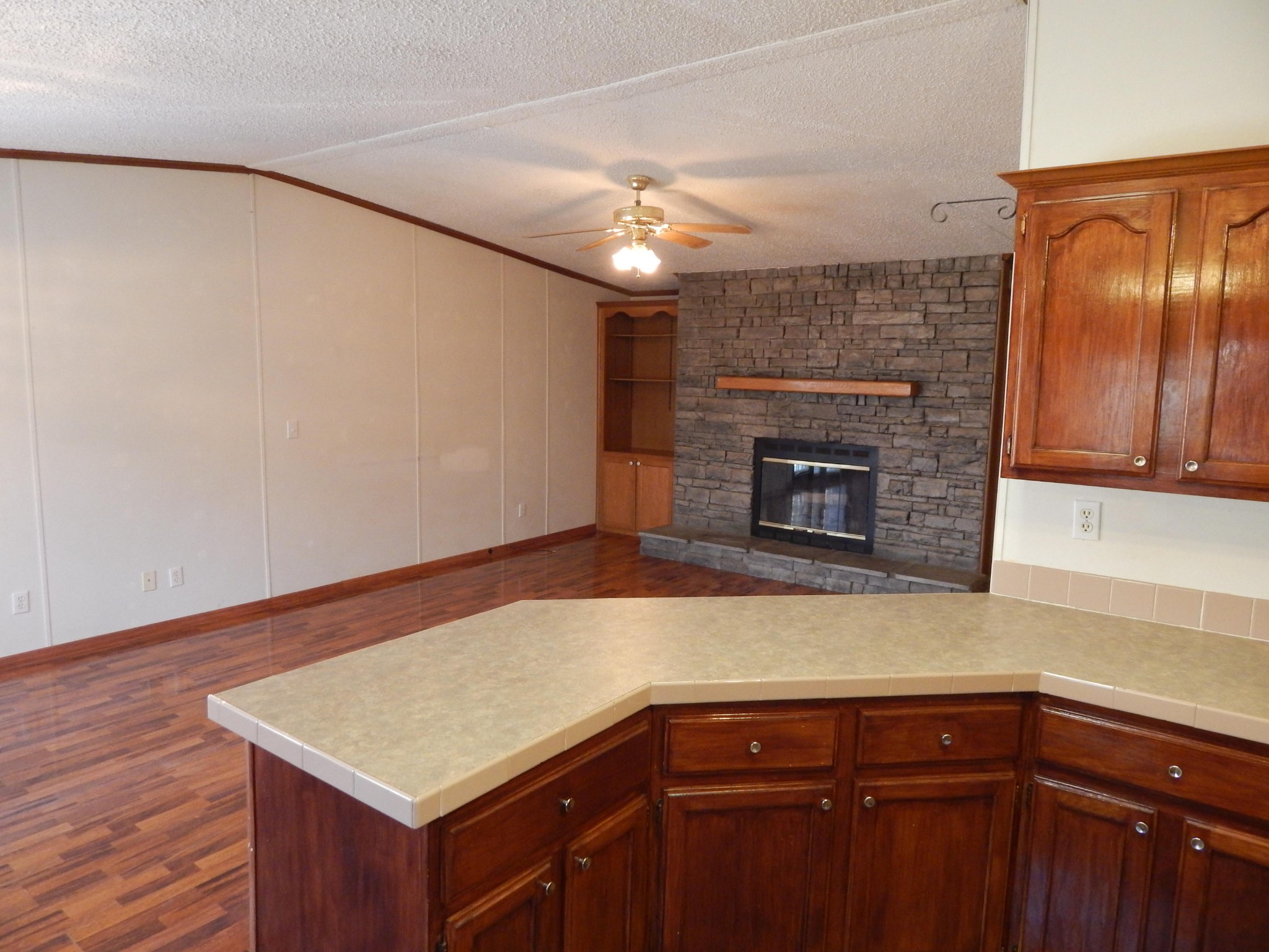 193 Crisman Road Heiskell, TN 37754 - Photo 28 of 31 a kitchen with a wooden floor and a fireplace