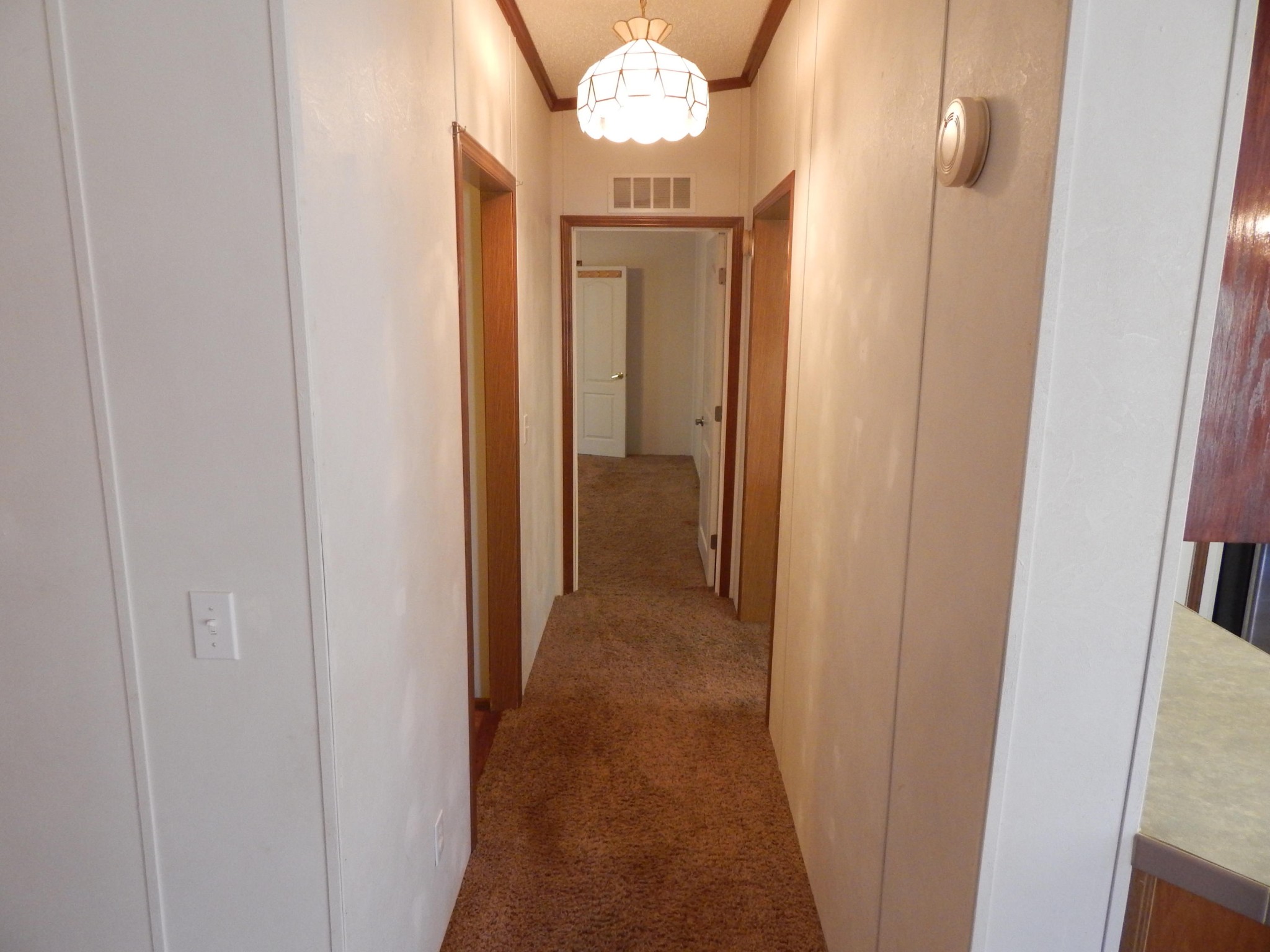 193 Crisman Road Heiskell, TN 37754 - Photo 29 of 31 a view of a hallway with a chandelier