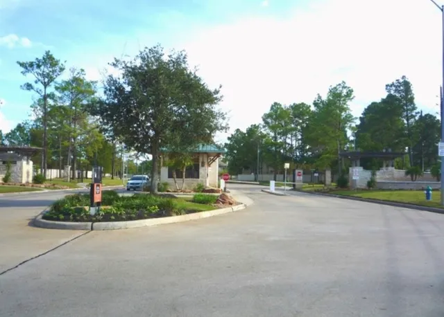 a view of a house with a yard and plants