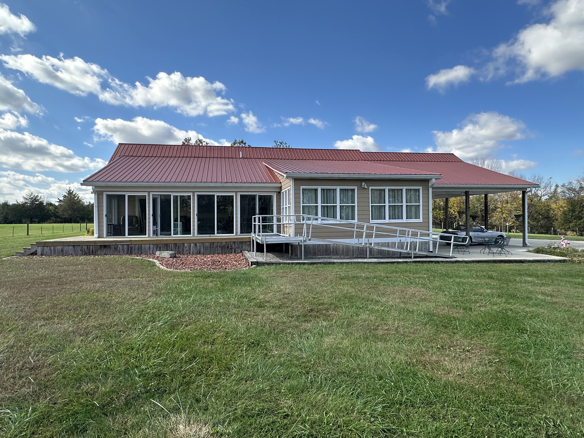 11144 Franklin Road Franklin, KY 42134 - Photo 7 of 47 a front view of a house with a yard table and chairs