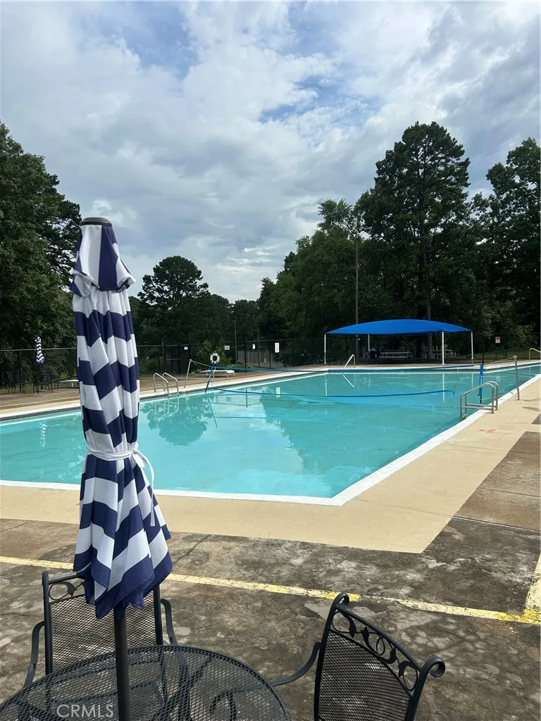 24 Edgemont Outside Area (outside Ca), AR 71913 - Photo 10 of 12 a view of a swimming pool with a yard