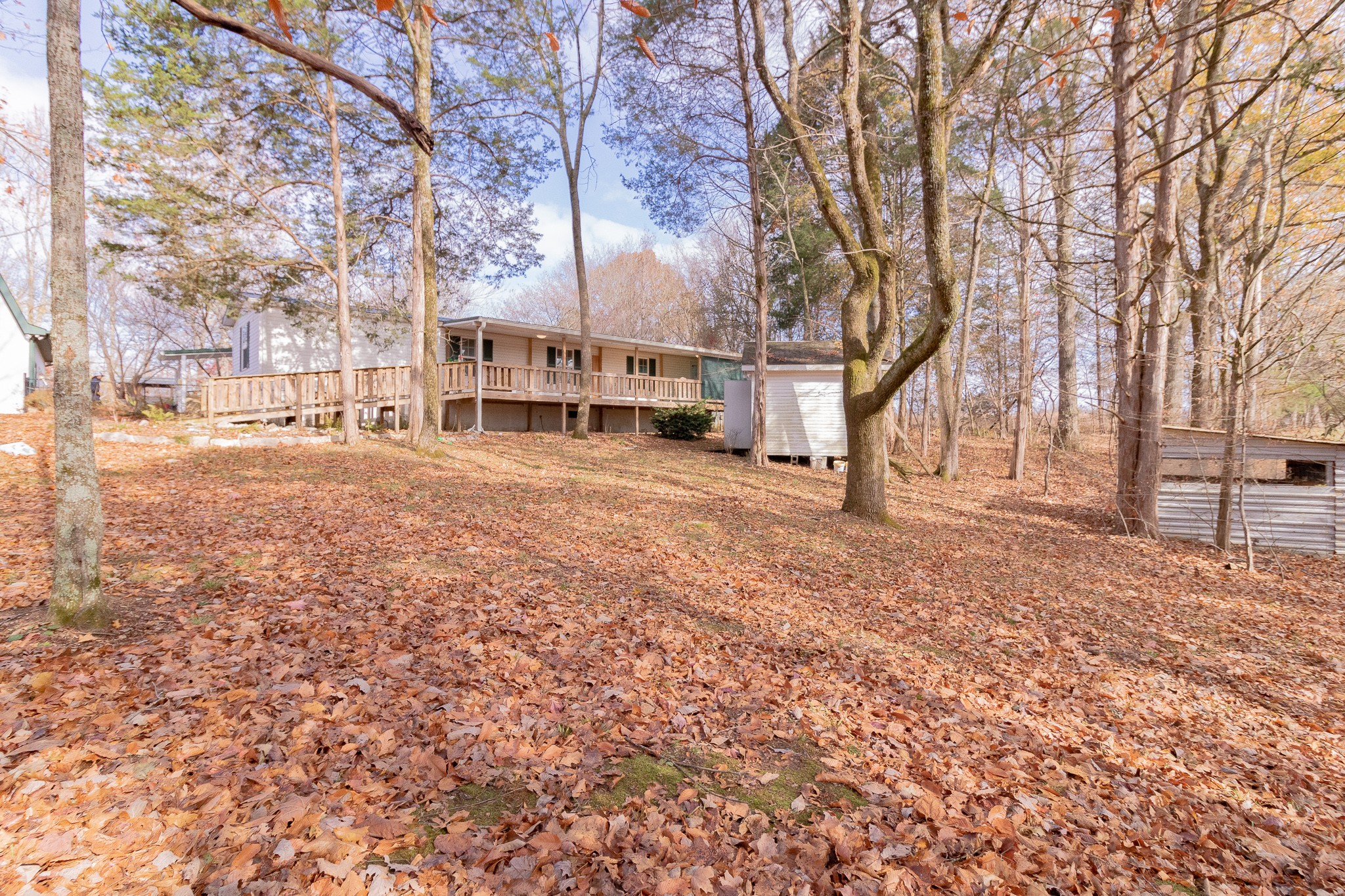 833 Speck Road Lebanon, TN 37087 - Photo 1 of 40 a view of a large house with a yard covered in snow