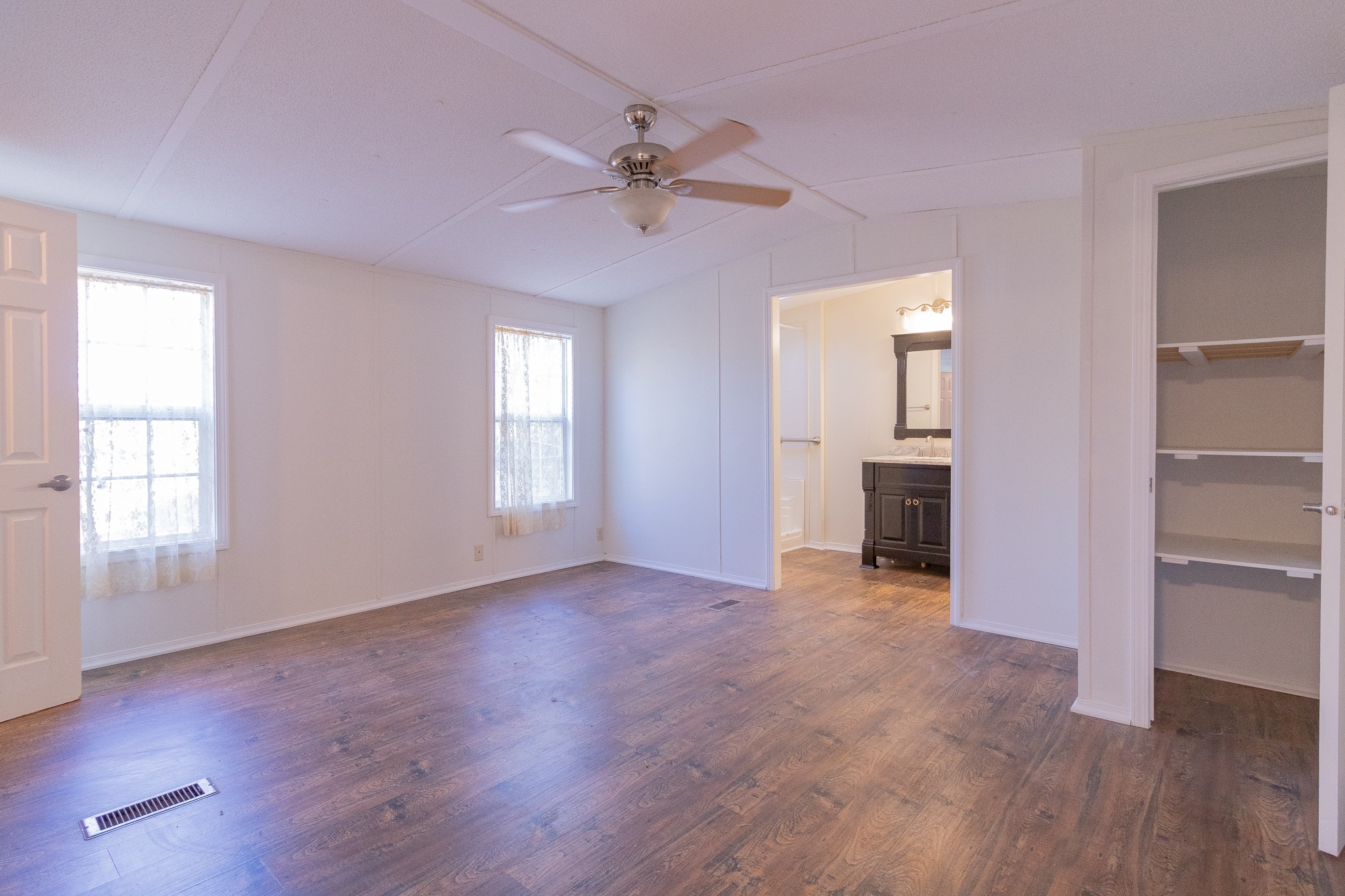 833 Speck Road Lebanon, TN 37087 - Photo 18 of 40 a view of an empty room with a window and wooden floor