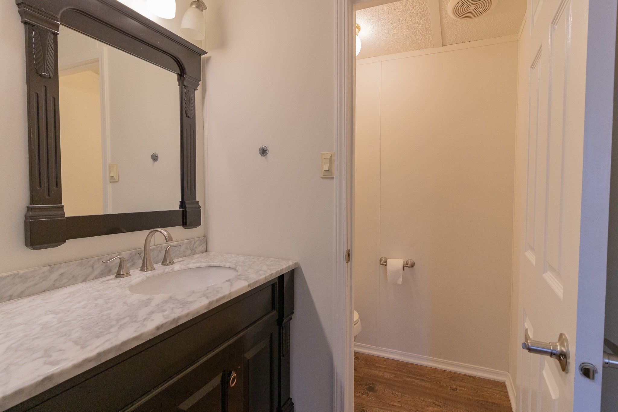 833 Speck Road Lebanon, TN 37087 - Photo 22 of 40 a bathroom with a granite countertop sink and a mirror